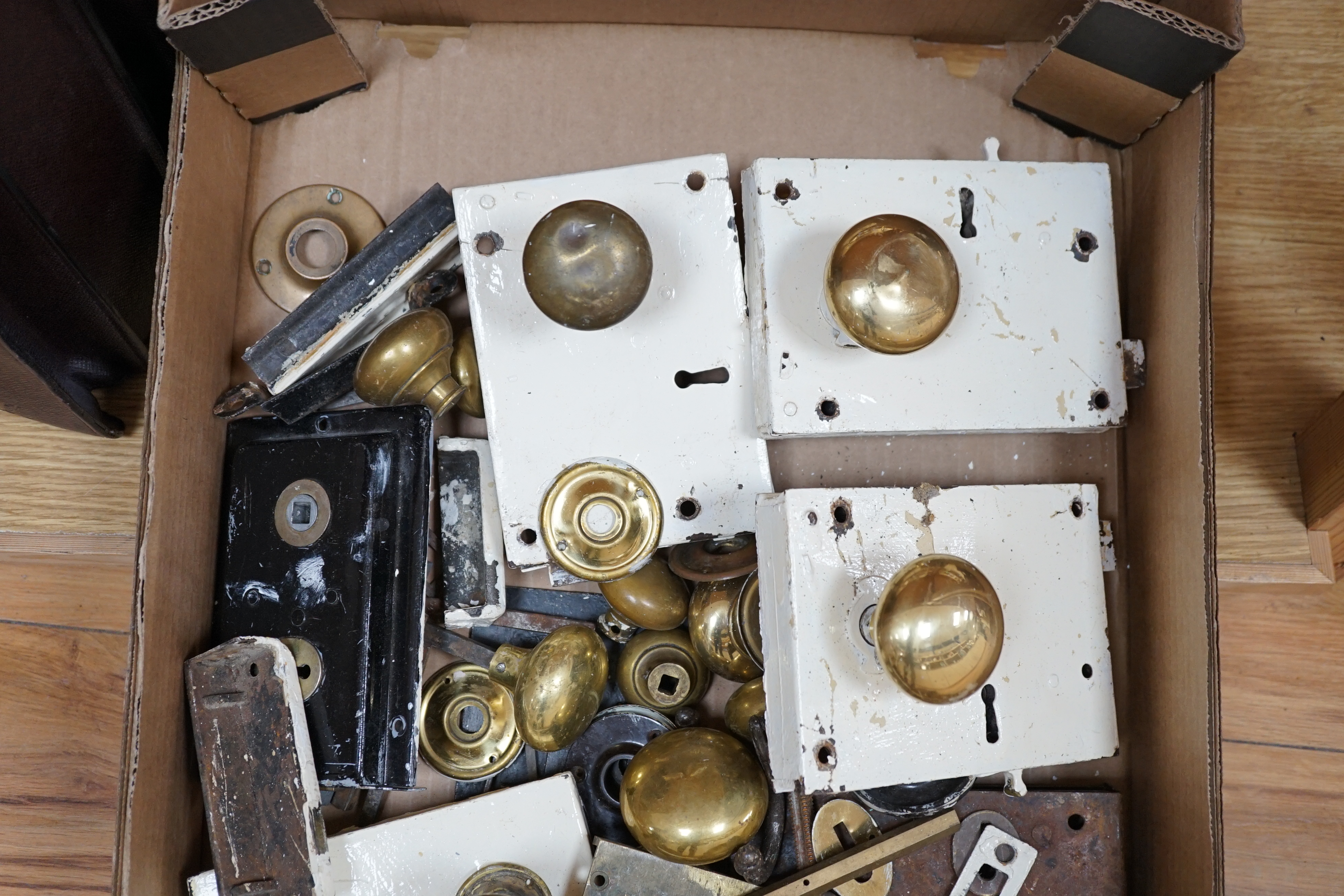 A collection of door locks and brass knobs